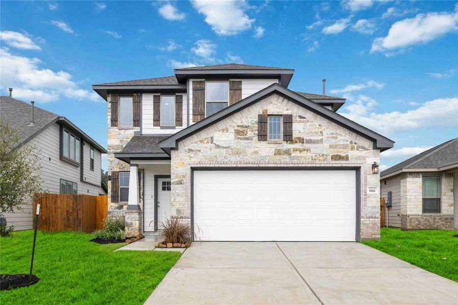 Front exterior of a new home in Granger Pines, Conroe, TX, highlighting curb appeal (Image 2). Front exterior of a new home in Granger Pines, Conroe, TX, highlighting curb appeal (Image 2).