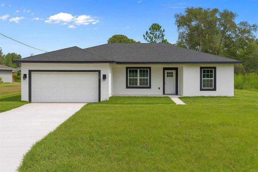Front exterior of a new home in , Ocklawaha, FL, highlighting curb appeal (Image 19).