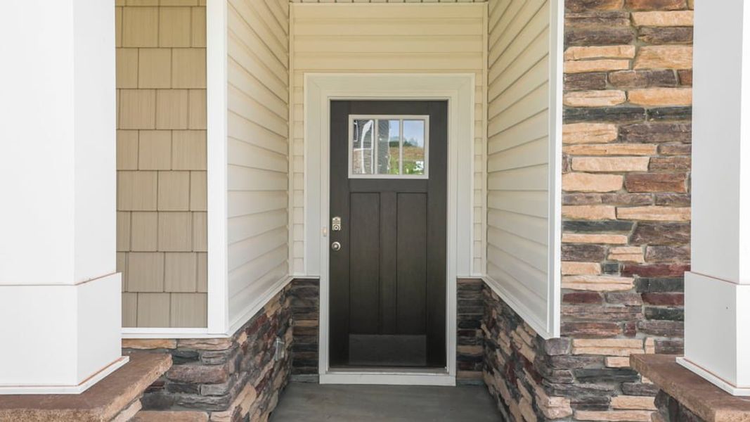 Exterior details and patio area of a home in Sherwood Gardens, Landrum (Image 4).