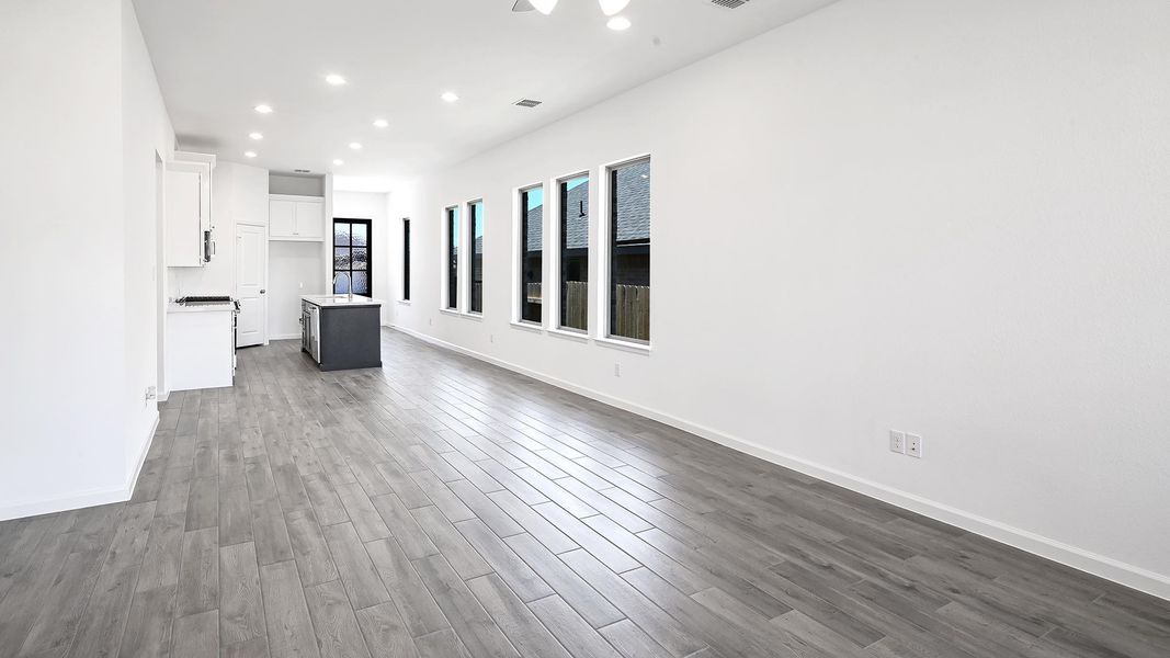 Unfurnished living room featuring recessed lighting, dark wood finished floors, and ceiling fan Unfurnished living room featuring recessed lighting, dark wood finished floors, and ceiling fan