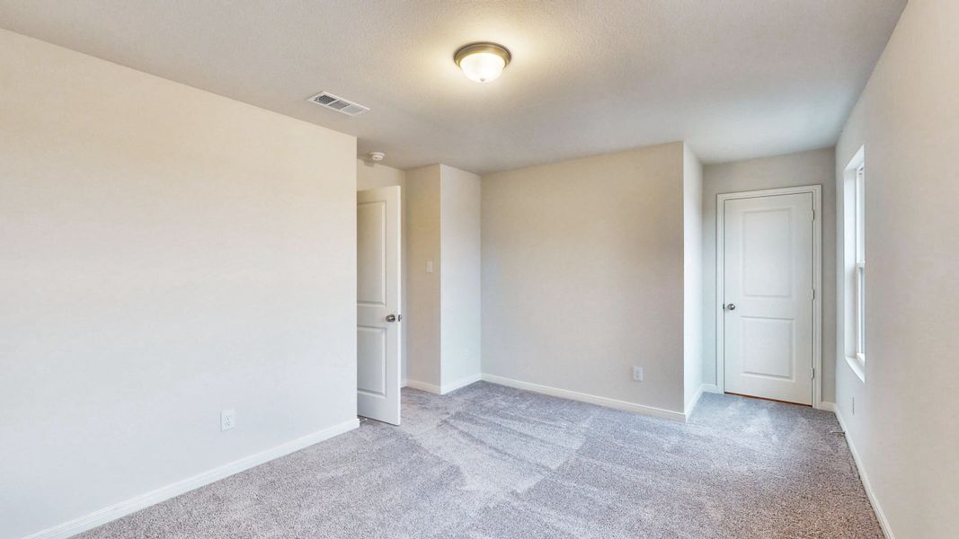 A hallway with white doors.