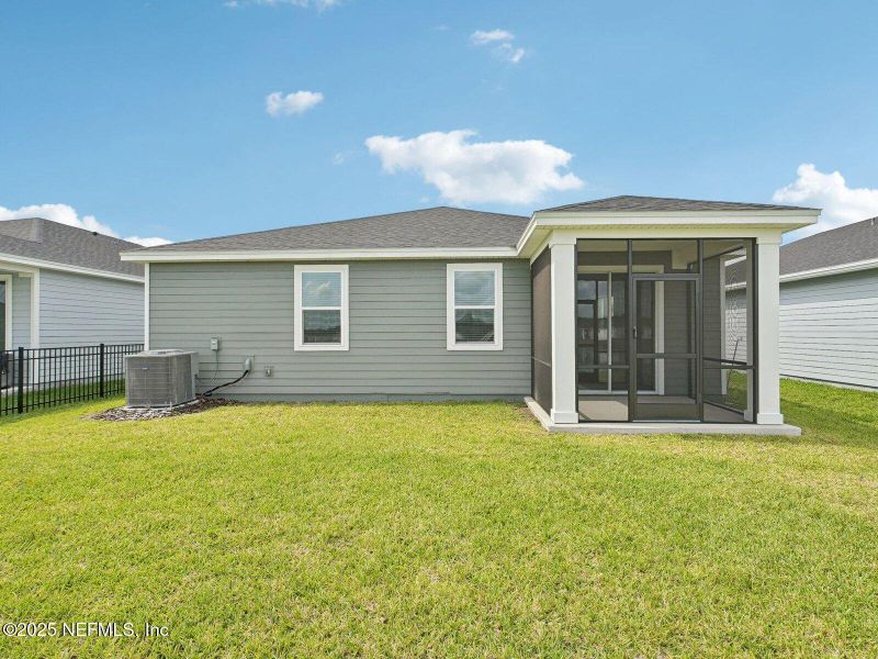 Front exterior of a new home in Lakes at Bella Lago - Signature Series, Green Cove Springs, FL, highlighting curb appeal (Image 1).