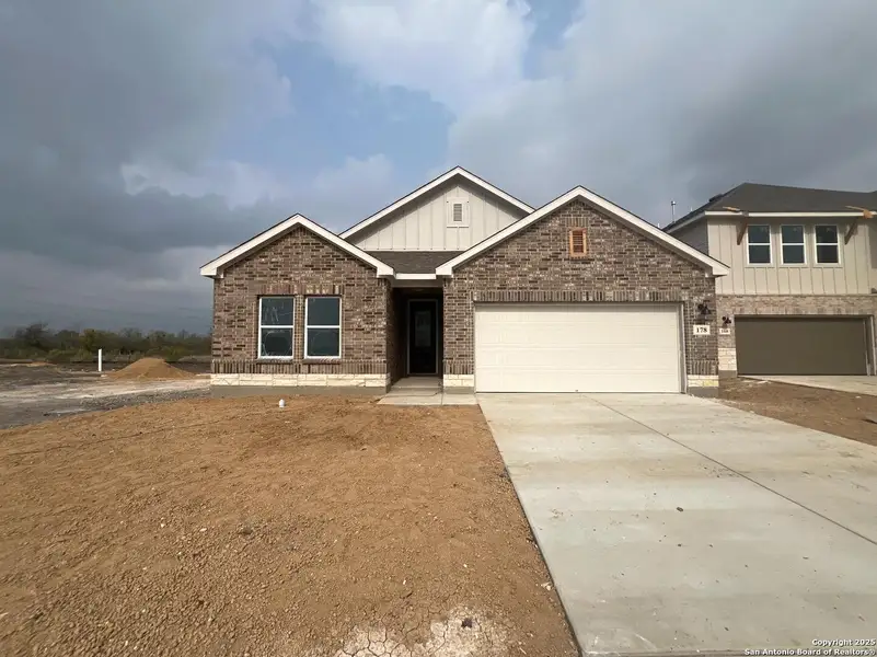 Front exterior of a new home in Nopal Valley, San Antonio, TX, highlighting curb appeal (Image 1). Front exterior of a new home in Nopal Valley, San Antonio, TX, highlighting curb appeal (Image 1).