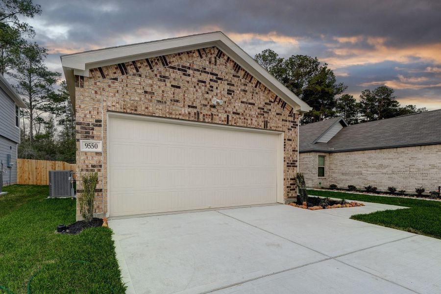 Front exterior of a new home in Creekside Court, Magnolia, TX, highlighting curb appeal (Image 6). Front exterior of a new home in Creekside Court, Magnolia, TX, highlighting curb appeal (Image 6).