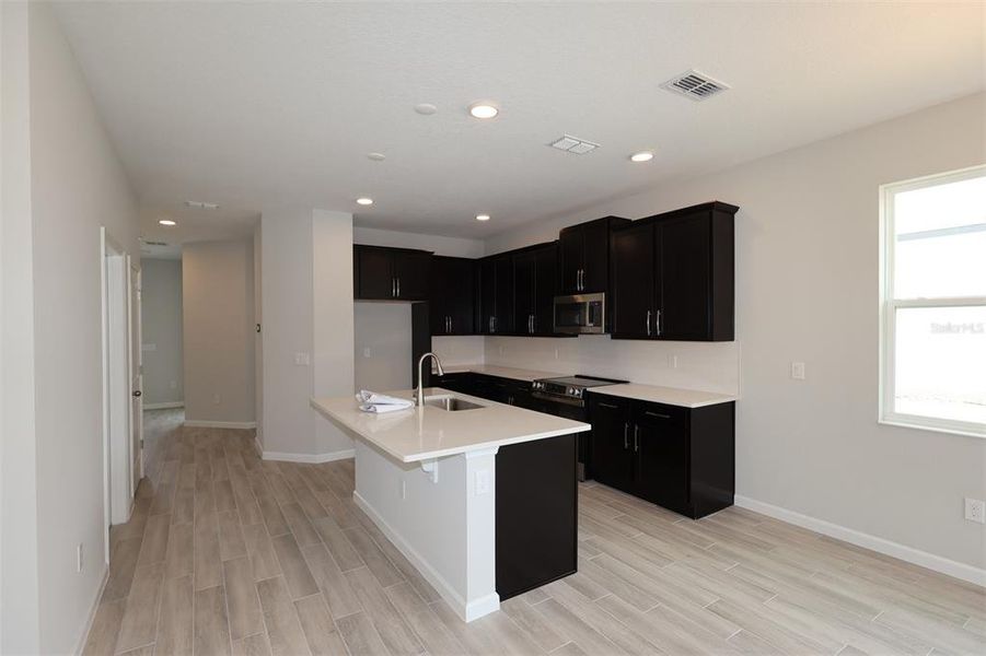 Furnished interior view inside a new home in Center Lake on the Park, St. Cloud (Image 8).