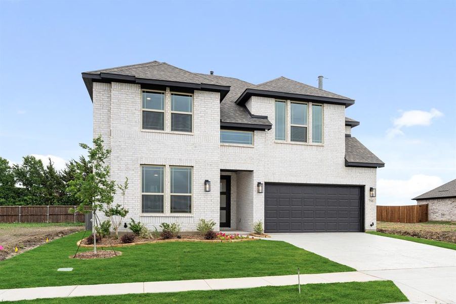 Front exterior of a new home in Grand Heritage, Lavon, TX, highlighting curb appeal (Image 2). Front exterior of a new home in Grand Heritage, Lavon, TX, highlighting curb appeal (Image 2).