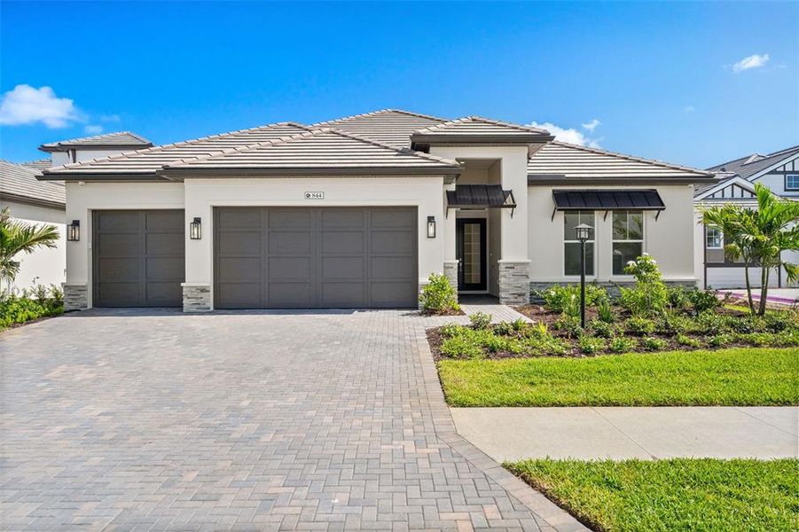 Front exterior of a new home in , Sarasota, FL, highlighting curb appeal (Image 2).