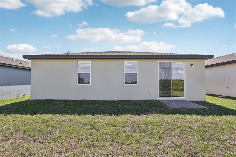 Exterior details and patio area of a home in Lake Deer Estates - Signature Series, Poinciana (Image 24).