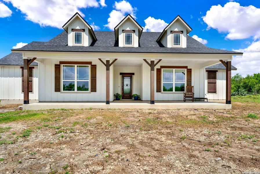 Front exterior of a new home in , Castroville, TX, highlighting curb appeal (Image 20). Front exterior of a new home in , Castroville, TX, highlighting curb appeal (Image 20).