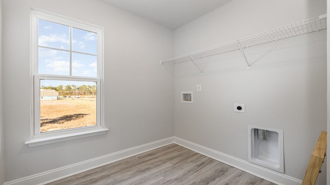 Spacious, unfurnished interior of a new home in Brunswick Plantation, Ash (Image 18).