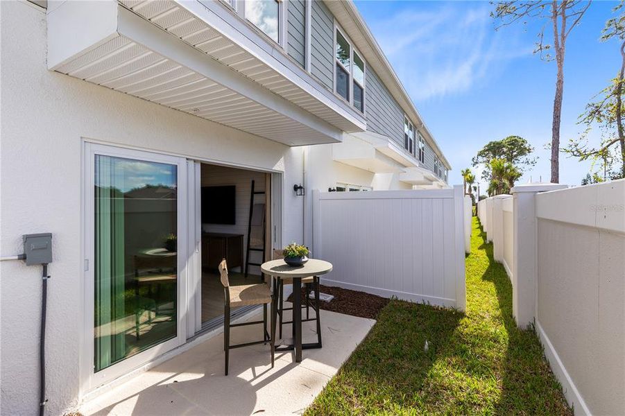 Exterior details and patio area of a home in Harbor Square, Palm Bay (Image 3).