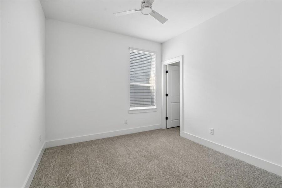 The secondary room features upgraded carpet, high ceilings and plenty of space.