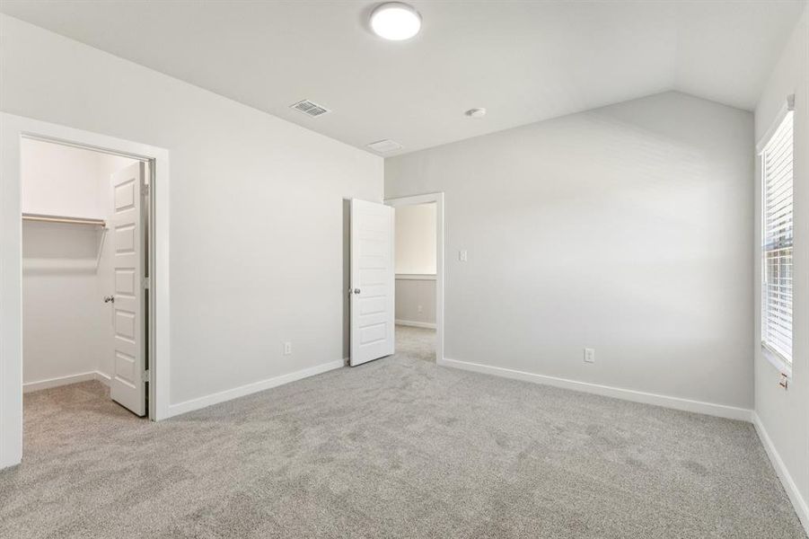 Bedroom in the Wimbledon home plan by Trophy Signature Homes – REPRESENTATIVE PHOTO