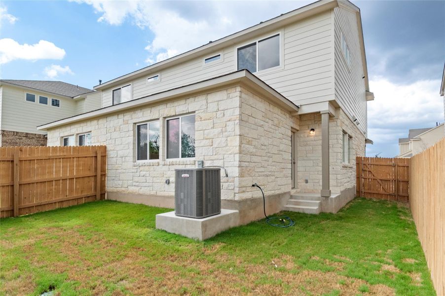 Front exterior of a new home in Saddle Creek Twinhomes, Georgetown, TX, highlighting curb appeal (Image 19). Front exterior of a new home in Saddle Creek Twinhomes, Georgetown, TX, highlighting curb appeal (Image 19).