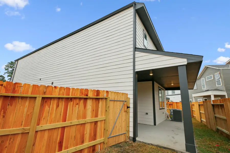 Exterior details and patio area of a home in Pinewood Trails - City Series, Atascocita (Image 3).