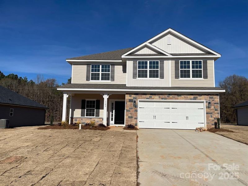 Front exterior of a new home in Kerns Ridge, Salisbury, NC, highlighting curb appeal (Image 1). Front exterior of a new home in Kerns Ridge, Salisbury, NC, highlighting curb appeal (Image 1).