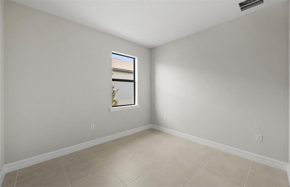 Spacious, unfurnished interior of a new home in Cedar Grove at The Woodlands, North Port (Image 17).