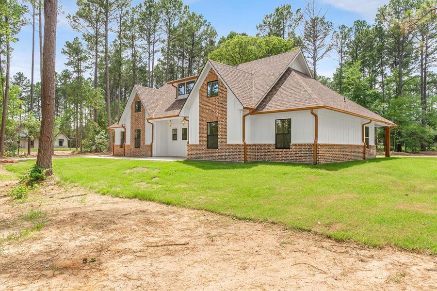 Front exterior of a new home in , Grand Saline, TX, highlighting curb appeal (Image 25).
