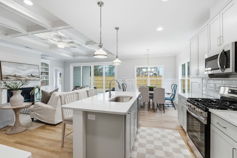 Representative furnished interior of a home built from the Kauai by Bill Clark Homes in The Sanctuary at Sunset Beach, Sunset Beach (Image 14).