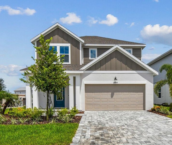 Representative exterior photo of a completed home built from the The Zander by David Weekley Homes in North River Ranch – Garden Series, Parrish, FL (Image 2). Representative exterior photo of a completed home built from the The Zander by David Weekley Homes in North River Ranch – Garden Series, Parrish, FL (Image 2).