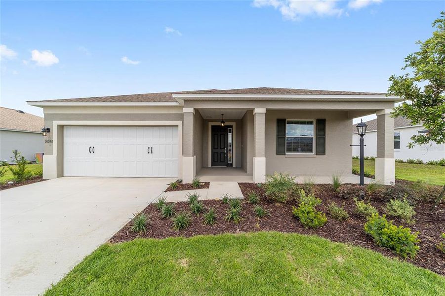 Front exterior of a new home in , Ocala, FL, highlighting curb appeal (Image 22). Front exterior of a new home in , Ocala, FL, highlighting curb appeal (Image 22).