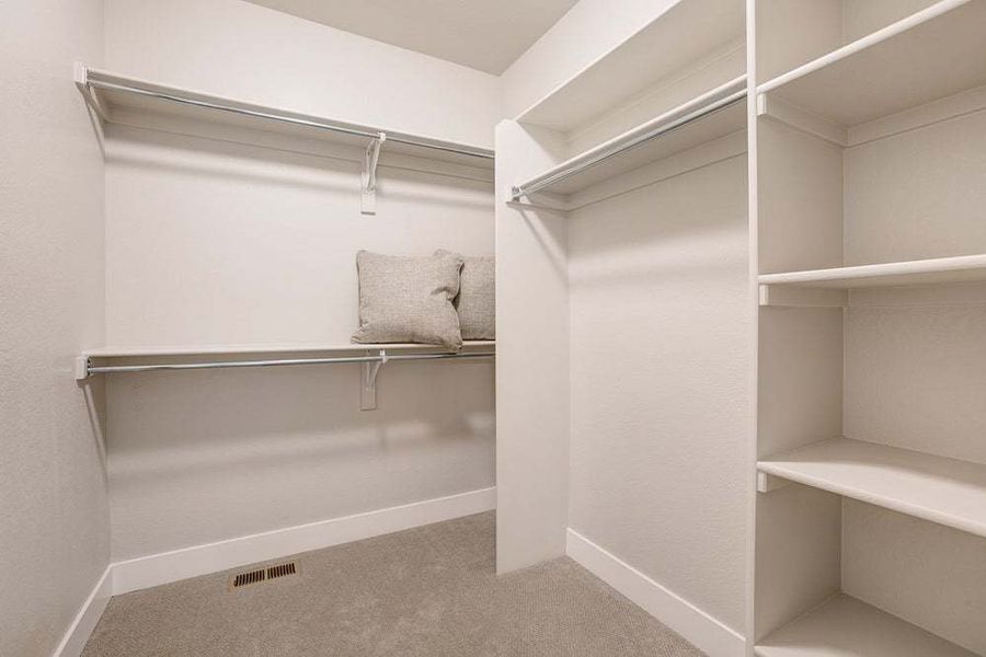 Primary Closet - Not Actual Home - Finishes May Vary