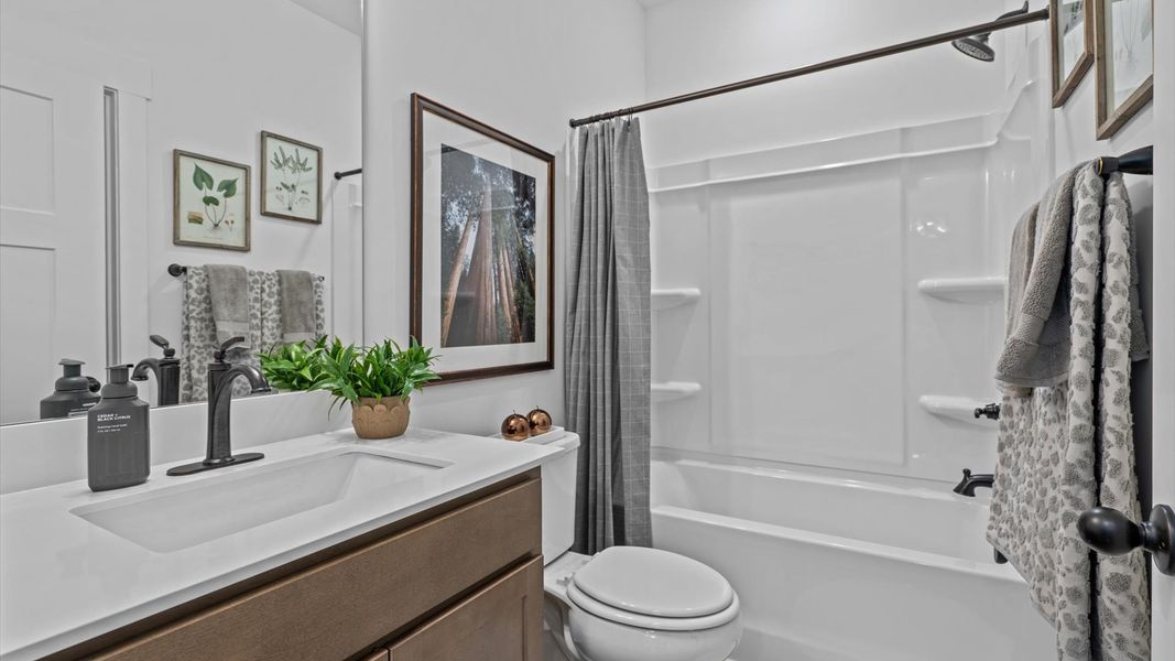 Top-notch bathroom with current fixtures, tasteful materials, and elevated charm