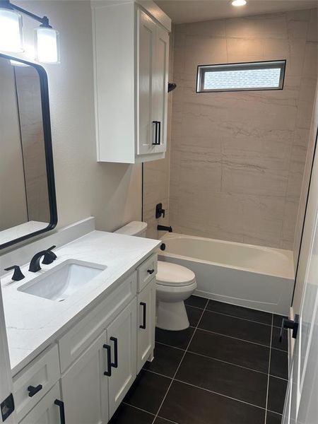 Second full bath with tub and tile to ceilings