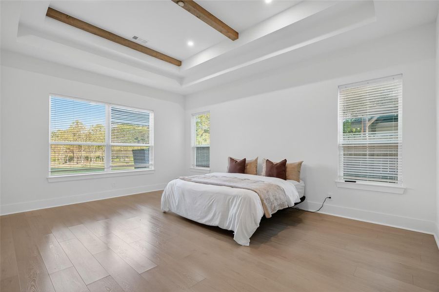 Another view of the primary suite showcases its generous proportions and bright, relaxing atmosphere. **Images are from a previously completed project. **