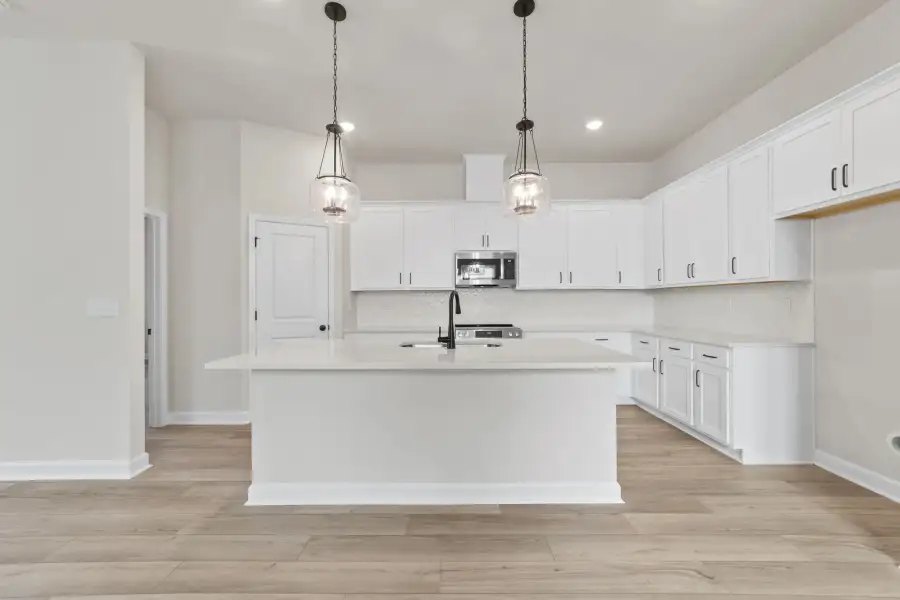 Sample Kitchen photo. Actual structural options and design finishes of home may vary.