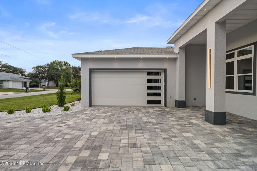 Front exterior of a new home in , Palm Coast, FL, highlighting curb appeal (Image 26). Front exterior of a new home in , Palm Coast, FL, highlighting curb appeal (Image 26).
