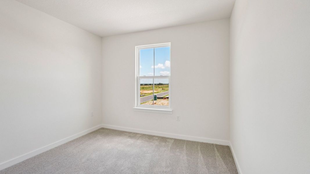 Secondary Bedroom located in the Jupiter in Hamilton Bluff located in Haines City, FL.