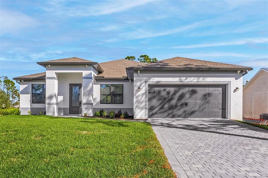 Front exterior of a new home in Lake Gallagher Estates, Dover, FL, highlighting curb appeal (Image 2).