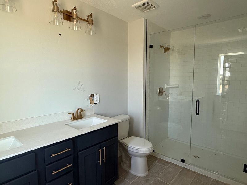 Luxurious primary bathroom featuring the AW Sapphire Collection