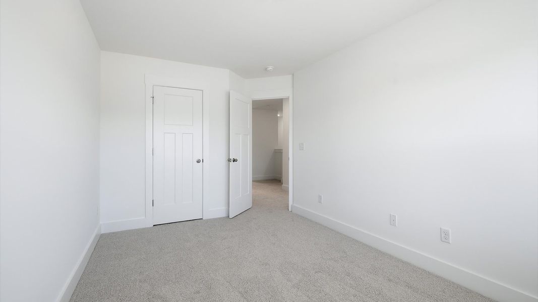 Well-crafted bedroom offering premium comfort and expansive storage solutions at Barton Hollow Well-crafted bedroom offering premium comfort and expansive storage solutions at Barton Hollow