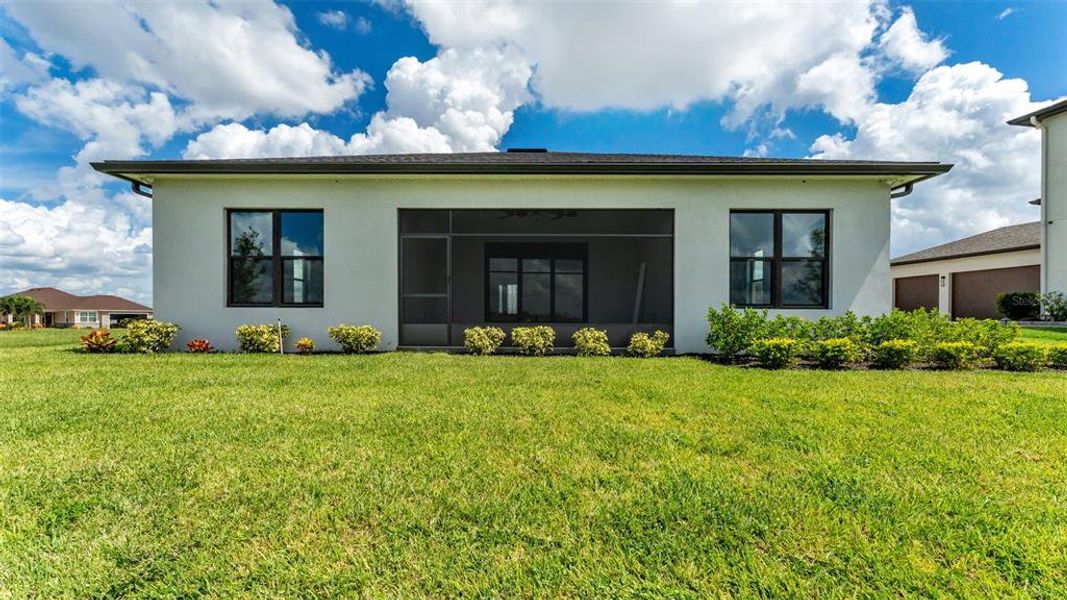Front exterior of a new home in , Auburndale, FL, highlighting curb appeal (Image 26). Front exterior of a new home in , Auburndale, FL, highlighting curb appeal (Image 26).