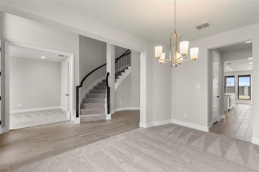 Inviting Entryway Features a Spacious, Light-Filled Formal Dining Area