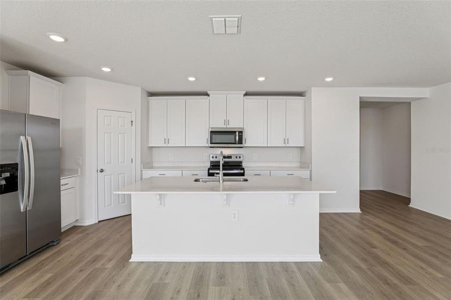 Furnished interior view inside a new home in Lake Deer Estates - Signature Series, Poinciana (Image 12).