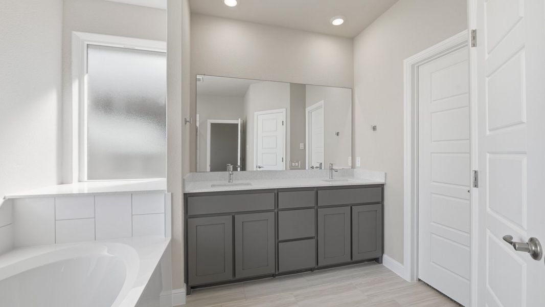 Representative furnished interior of a home built from the BASSWOOD by D.R. Horton in Treeline, Justin (Image 16).