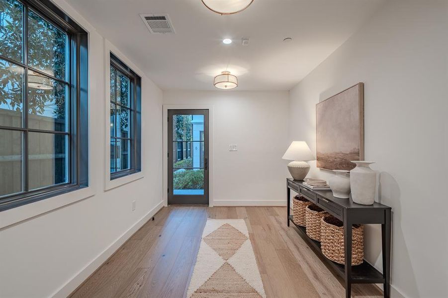 Entryway with wood finished floors and baseboards Entryway with wood finished floors and baseboards