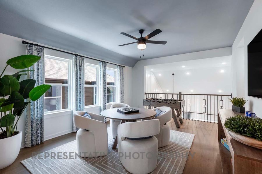 Dining space featuring dark wood finished floors and ceiling fan
