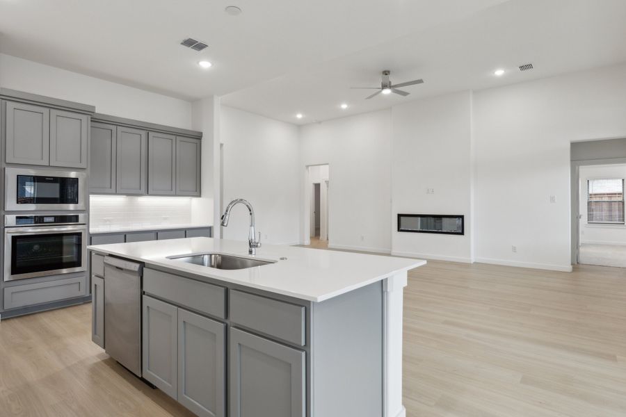 Kitchen in the Gilmour II home plan by Trophy Signature Homes – REPRESENTATIVE PHOTO