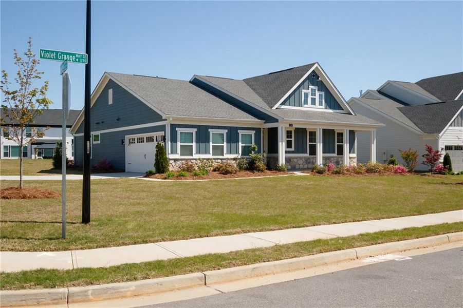Front exterior of a new home in Sweetbay Farm, Lawrenceville, GA, highlighting curb appeal (Image 28).