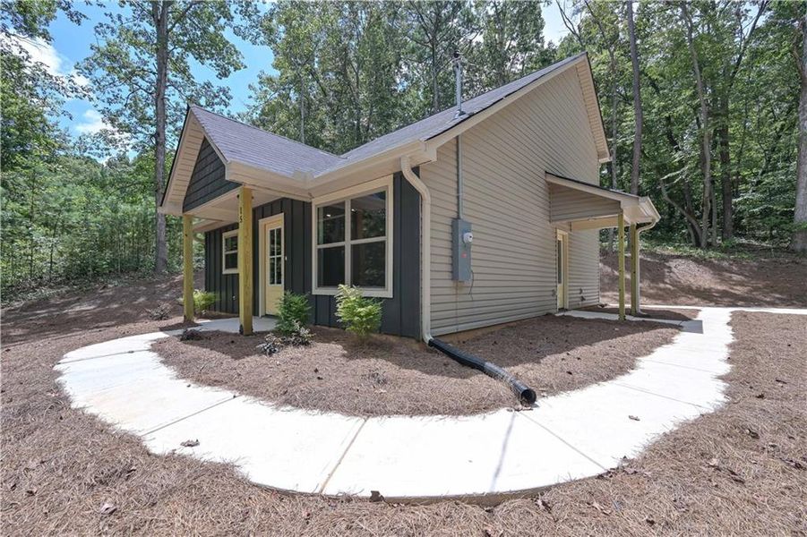 Front exterior of a new home in , Buchanan, GA, highlighting curb appeal (Image 15).