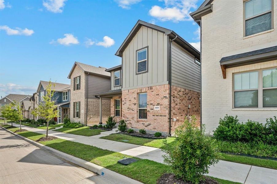 Front exterior of a new home in Heritage Village, Haltom City, TX, highlighting curb appeal (Image 2). Front exterior of a new home in Heritage Village, Haltom City, TX, highlighting curb appeal (Image 2).