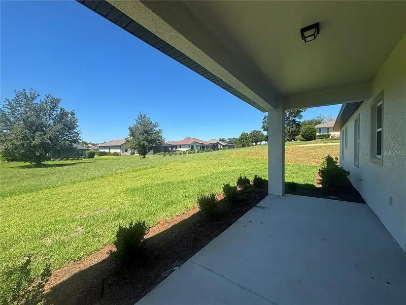 Exterior details and patio area of a home in , Lady Lake (Image 25).