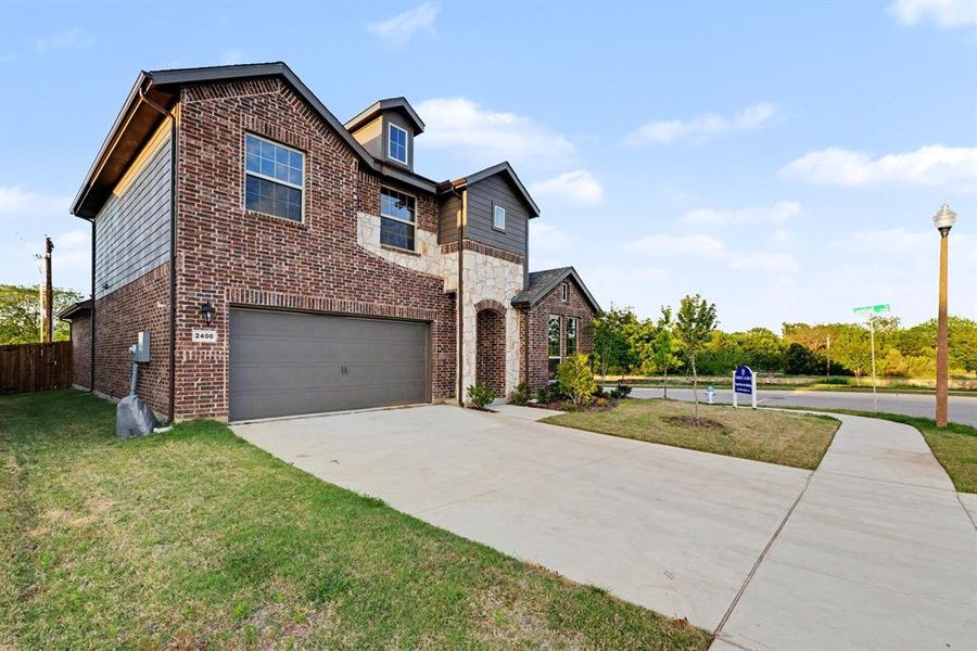 Front exterior of a new home in Courts Of Bonnie Brae, Denton, TX, highlighting curb appeal (Image 18).
