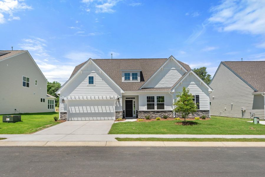 Front exterior of a new home in Wexford, Elon, NC, highlighting curb appeal (Image 30).