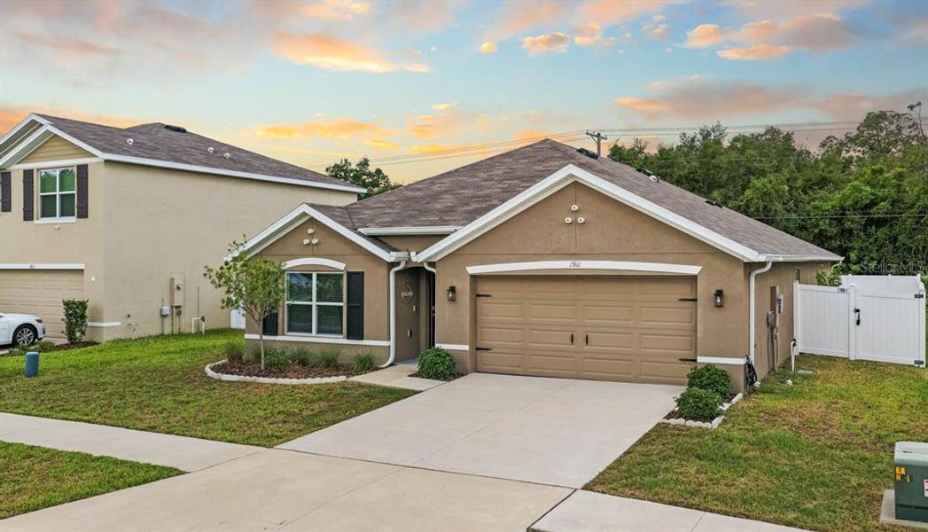 Front exterior of a new home in Brookside, Ruskin, FL, highlighting curb appeal (Image 32).