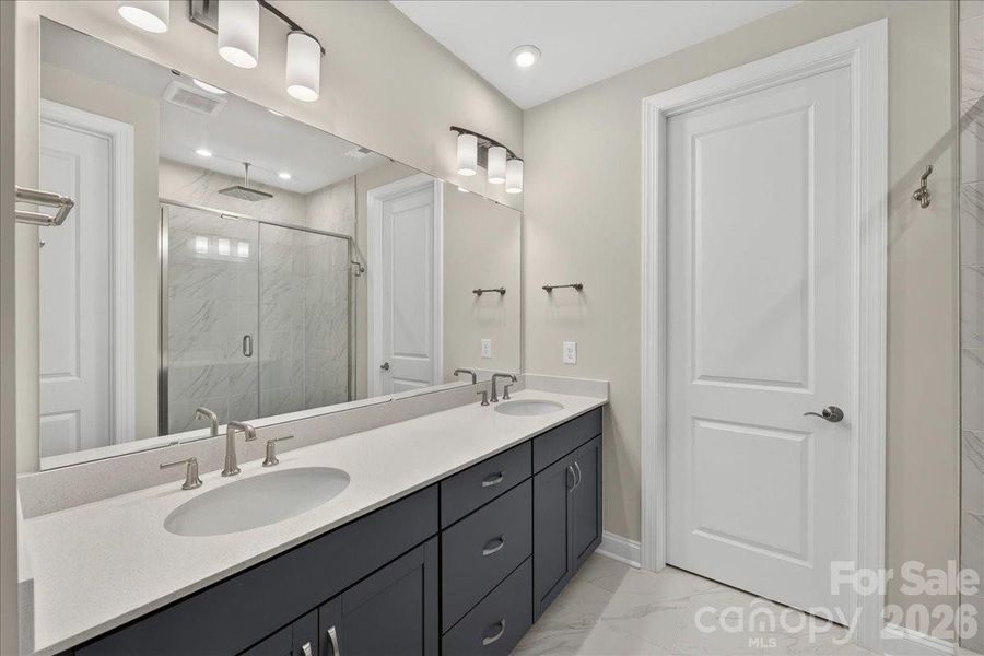 Dual vanity primary bathroom with cabinets with drawers Dual vanity primary bathroom with cabinets with drawers